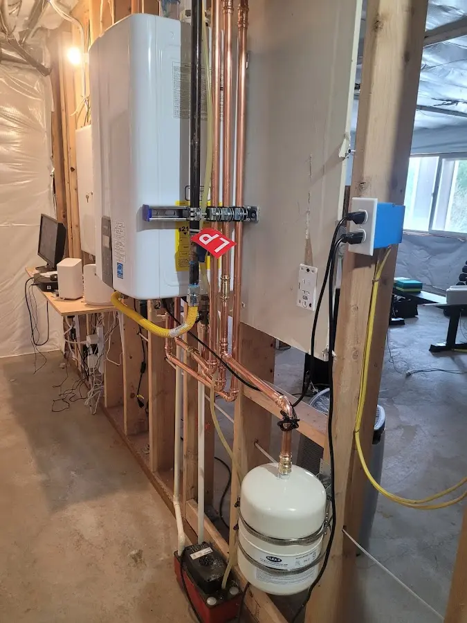 Licensed plumber repairing a kitchen sink in Alexandria